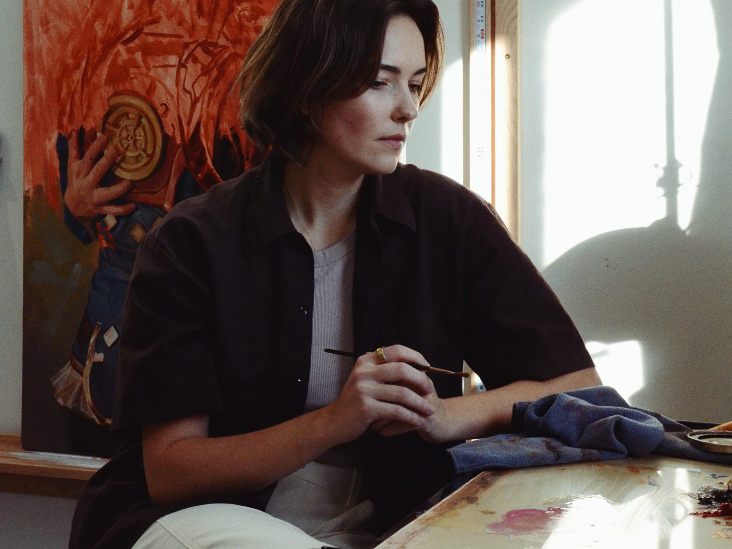 Halie Torris painting in her studio